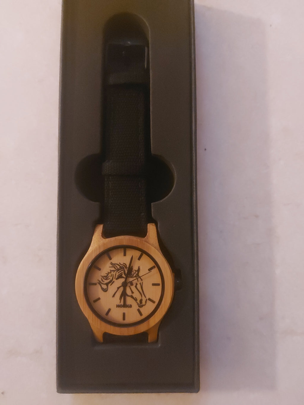 Wooden horses head watcho